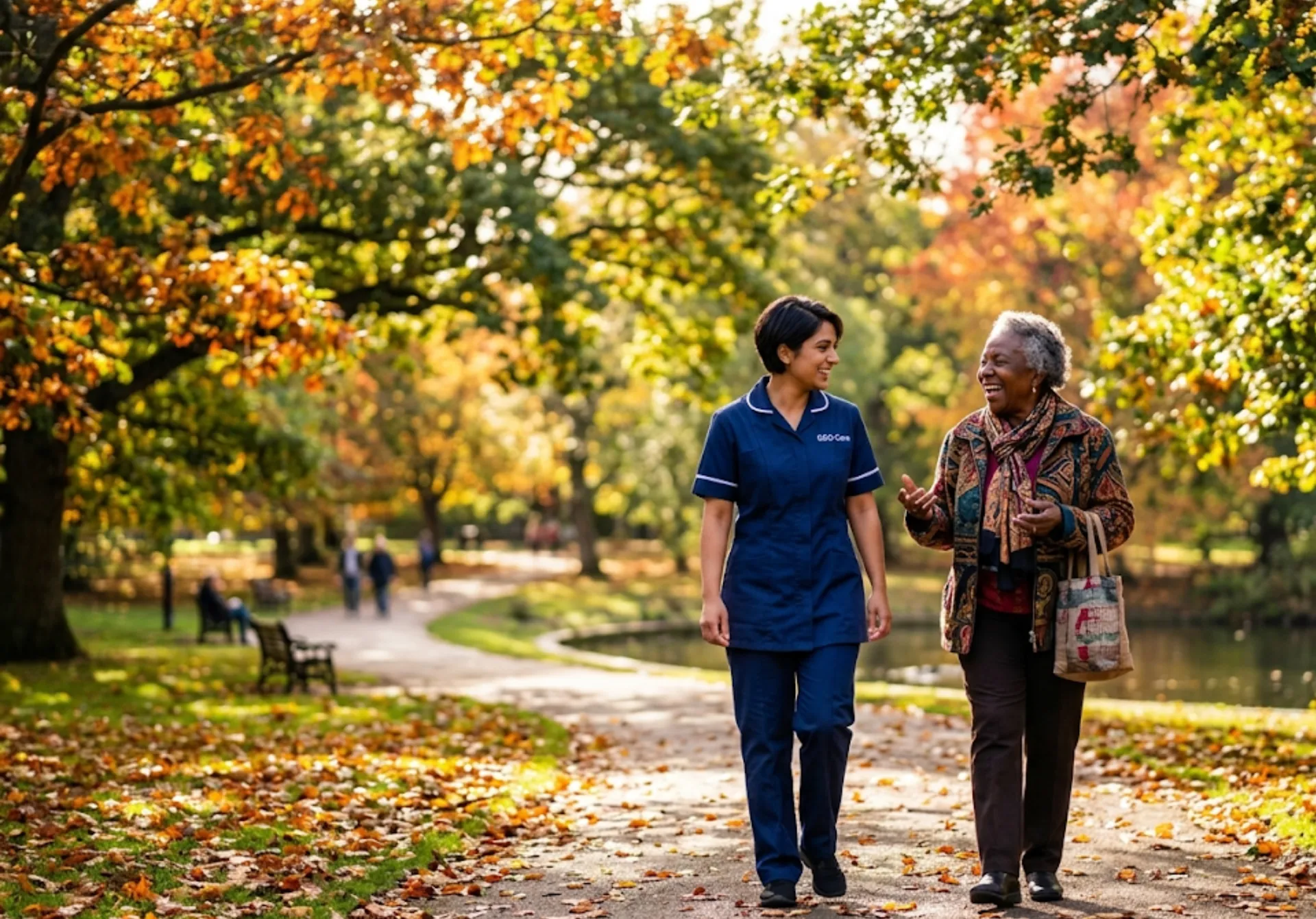 A GEG Care companion carer walking and talking with an elderly female client in a local park in Luton, enjoying outdoor companionship and social engagement.